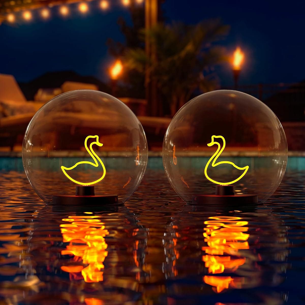 Two floating globes holding neon swan filaments above their own reflections