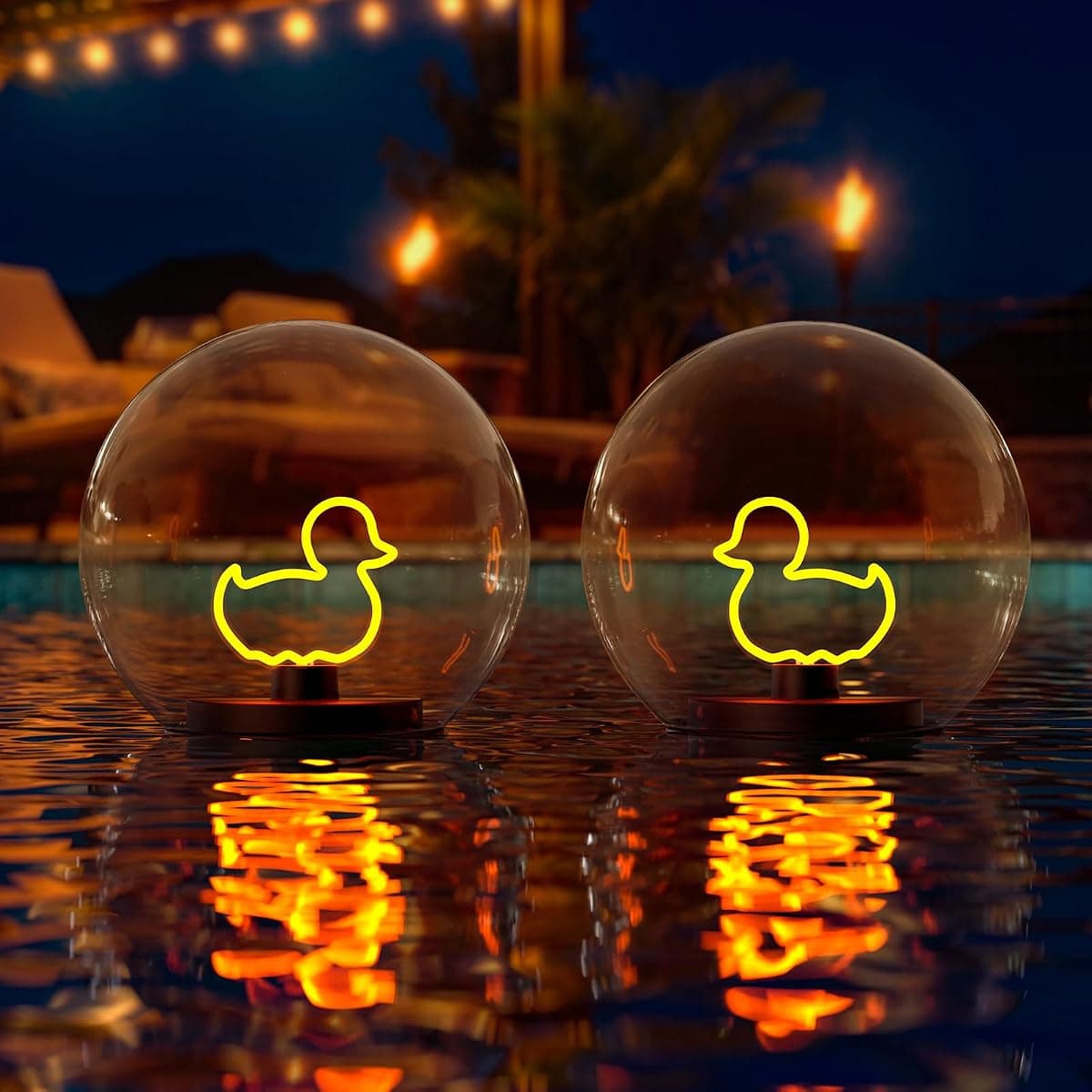 Two floating globes holding neon duck filaments, glowing over the water