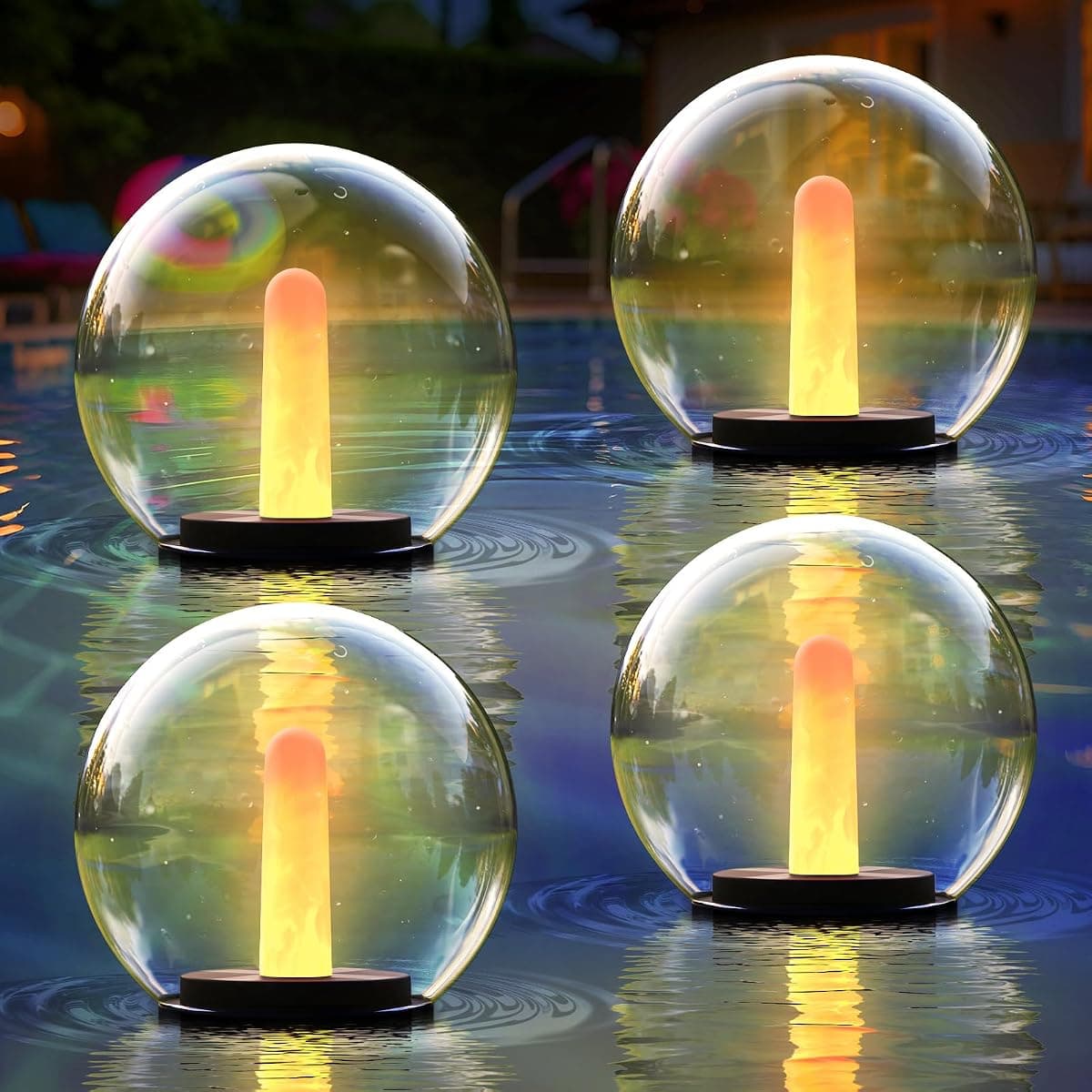 Four lit glass globes scattered across a swimming pool at night
