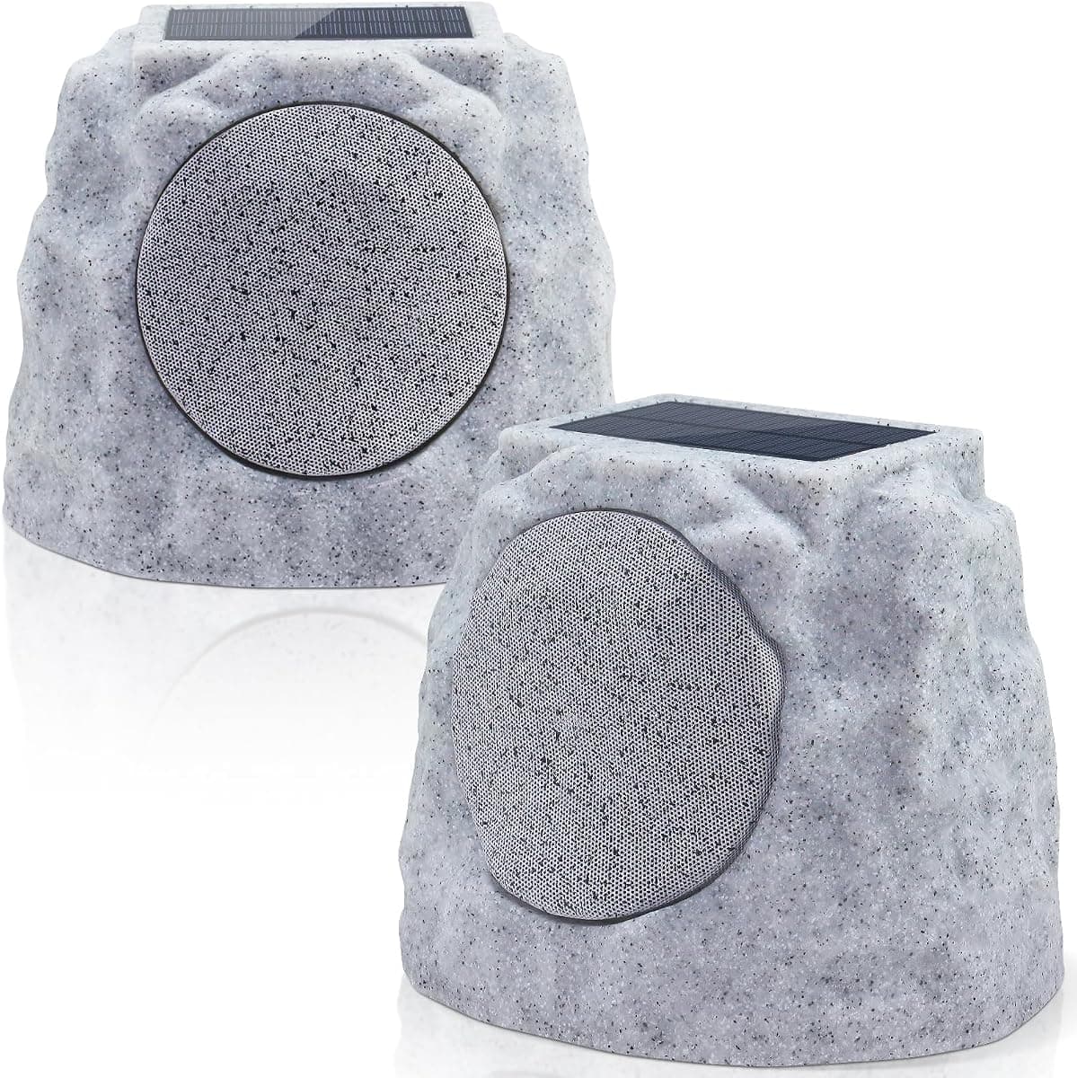 A pair of pale limestone rock-shaped outdoor speakers